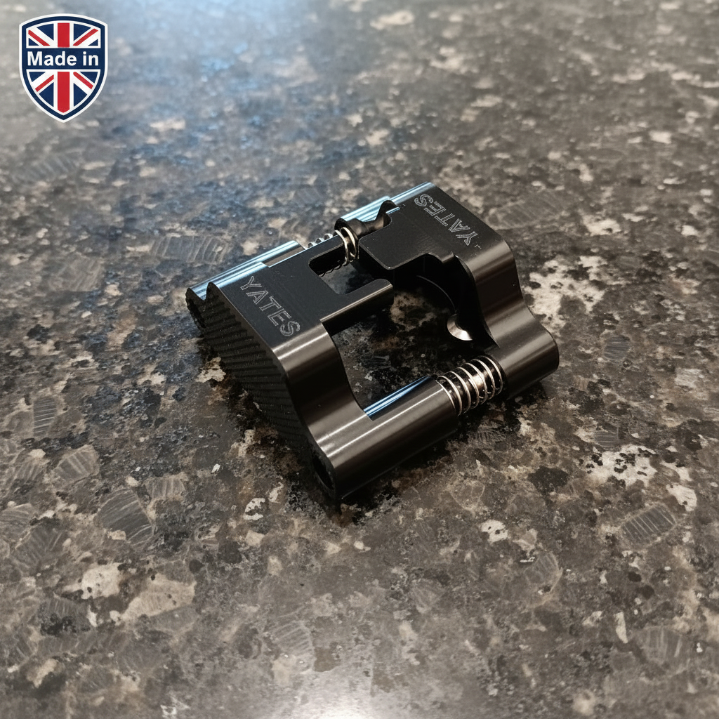 The black wine foil cutter sitting on a marbled dark granite surface, with a made in Britain logo in the top left hand corner of the photo to signify that the foil cutter is proudly made in Britain.